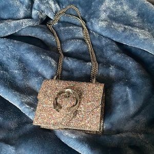 jimmy choo hand bag opened but never worn